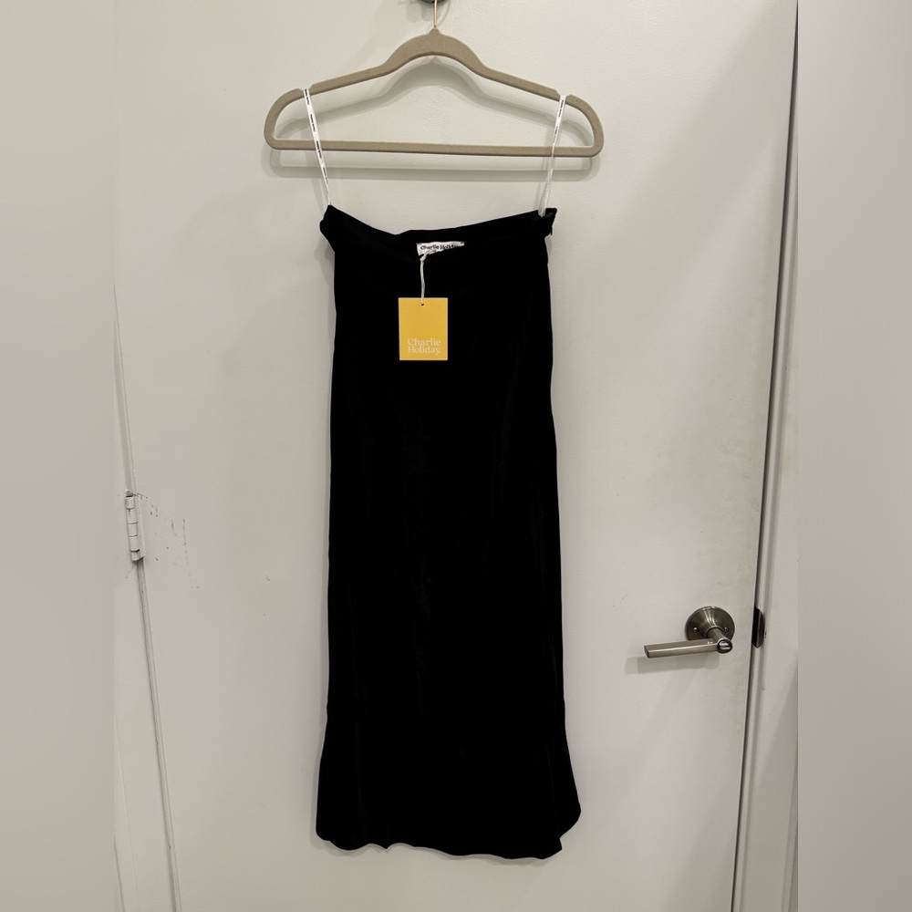 Brand new Charlie Holiday black midi skirt
(NWT).